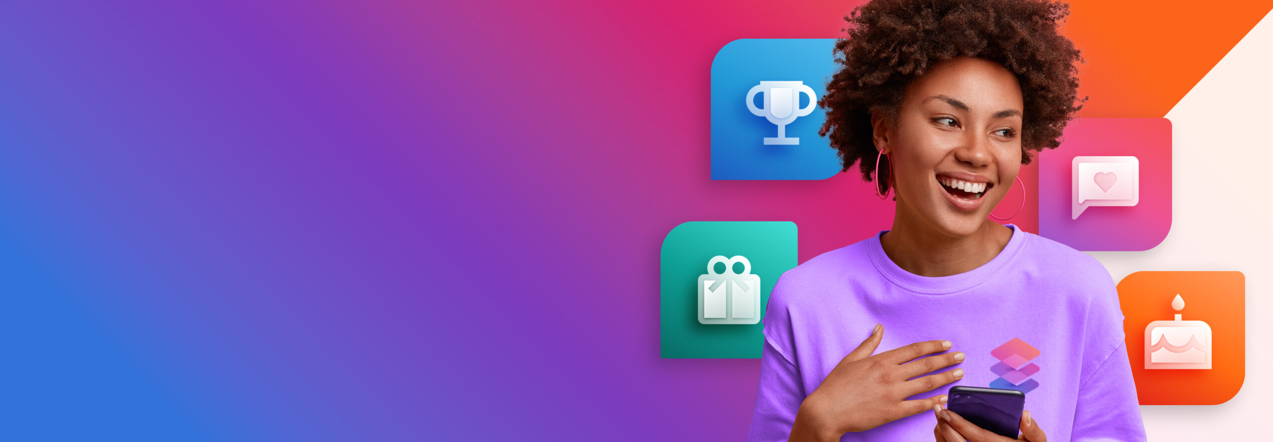 A person with curly hair, wearing a purple shirt, holds a smartphone and smiles. The background is a gradient with colorful icons, including a trophy, chat bubble, heart, gift, and cake.