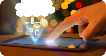 A hand touches a glowing tablet screen, projecting icons of electronic devices like a computer, phone, and tablet. Above, a cloud symbol signifies cloud computing. Background features blurred lights, suggesting a digital or technology theme.